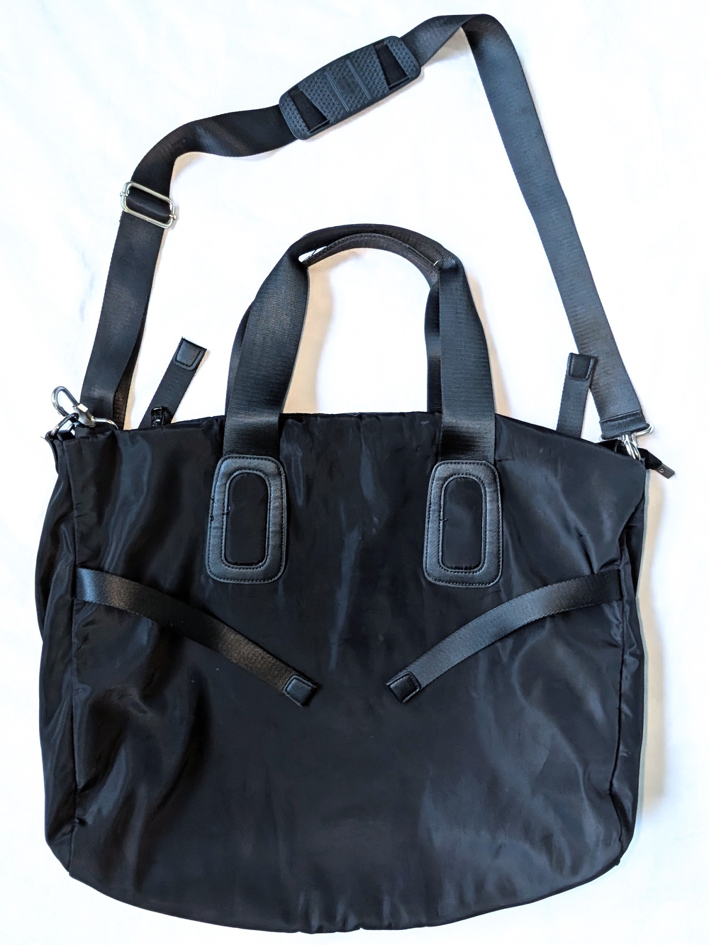 BOBO black nylon travel tote/weekender bag in a sleek minimalist design.
Feature
